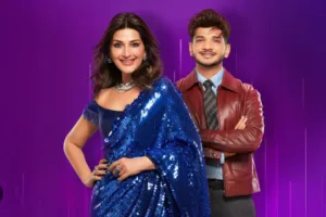पंगा सीज़न 2: होस्ट डेस्क के सामने खड़ी सेलिब्रिटी जोड़ियों का मूल इलस्ट्रेशन